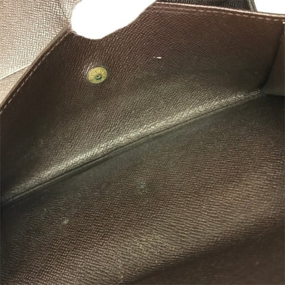 LOUIS VUITTON ルイヴィトン ダミエ ポルトトレゾールインターナショナル 長財布 ユニセックス 三つ折り 小銭入れあり ホック ブラウン N61215 中古 T1