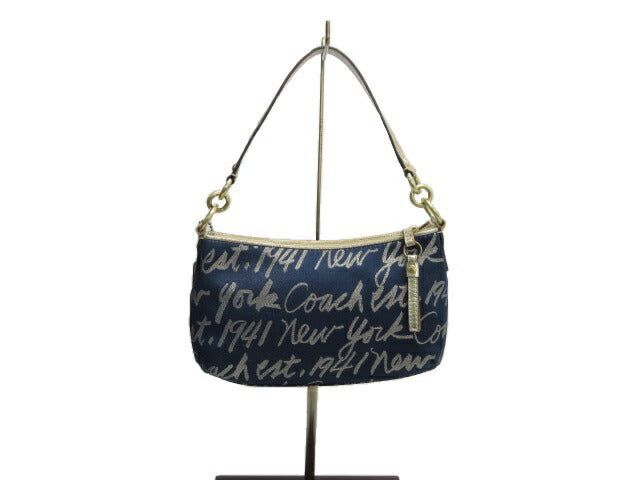 COACH/コーチルレックス ハートデミポーチ中古 ネイビーに華やかなゴールドとハートマークがアクセント♪